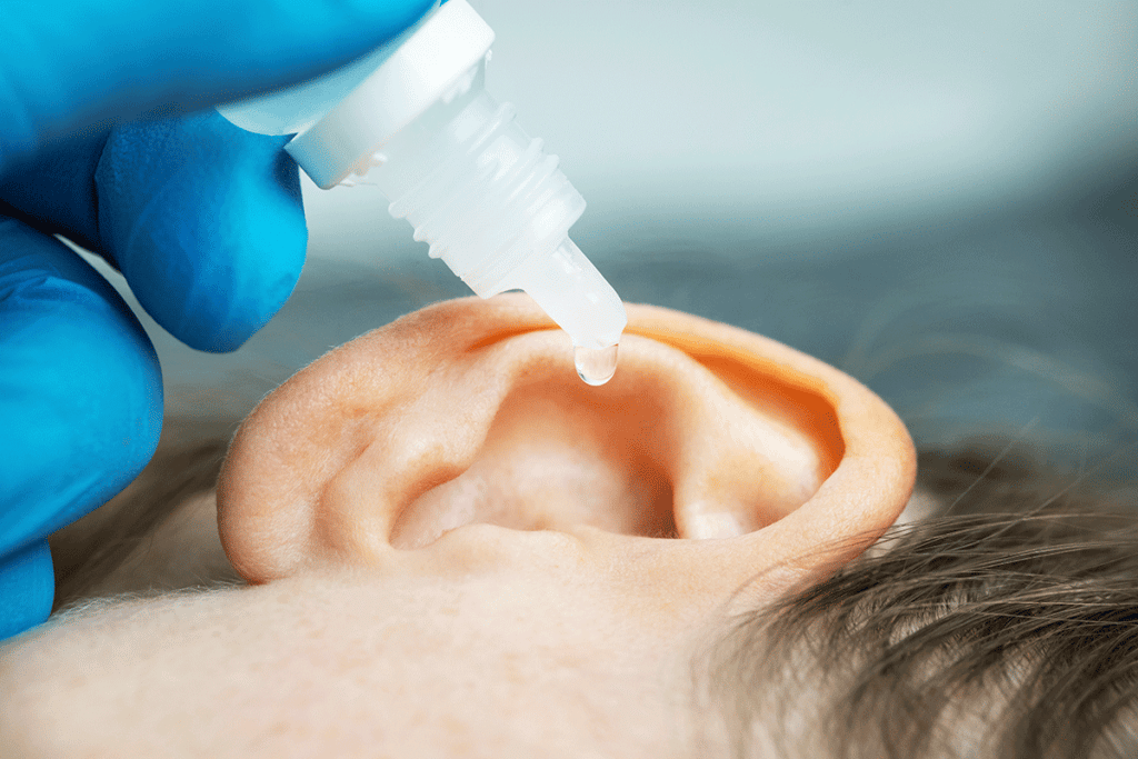 Child putting peroxide in his ear in Concord, NH